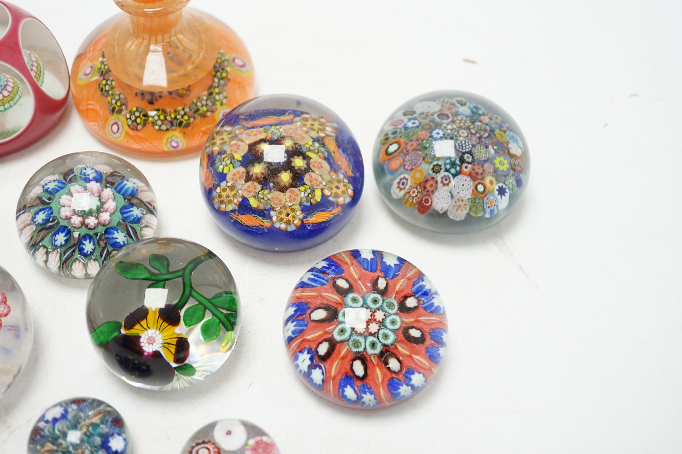 A collection of eleven glass paperweights, largest 10cm high. Condition - good
